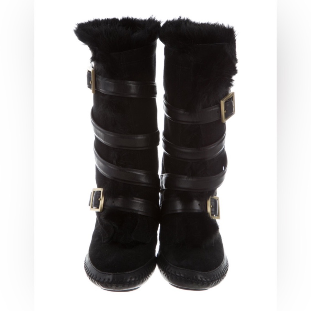 Black Fur filled Tory Burch boots 
never worn no box 
Perfect condition 
Size 6
